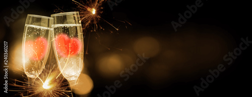 Photography Sparkling wine tinkelt and hearts in the glasses, greeting card Valentine's Day