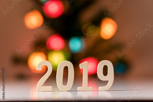 wood number 2019 for happy new year on white background