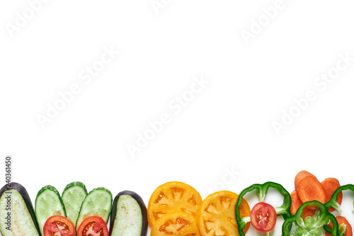 Fototapeta Naklejka Na Ścianę i Meble -  Cropped fresh vegetables. Isolated tomatoes, cucumbers, peppers, egg plant