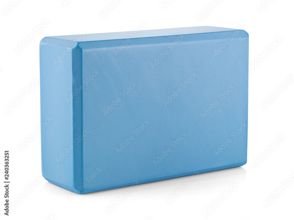 Blue polypropylene yoga cube isolated on white background. Selective focus. Sports and health products.
