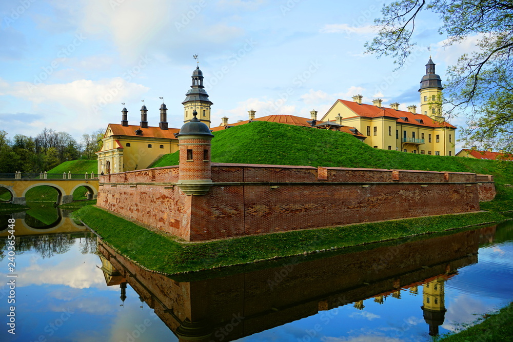 Old castle with a fortress wall made of red bricks