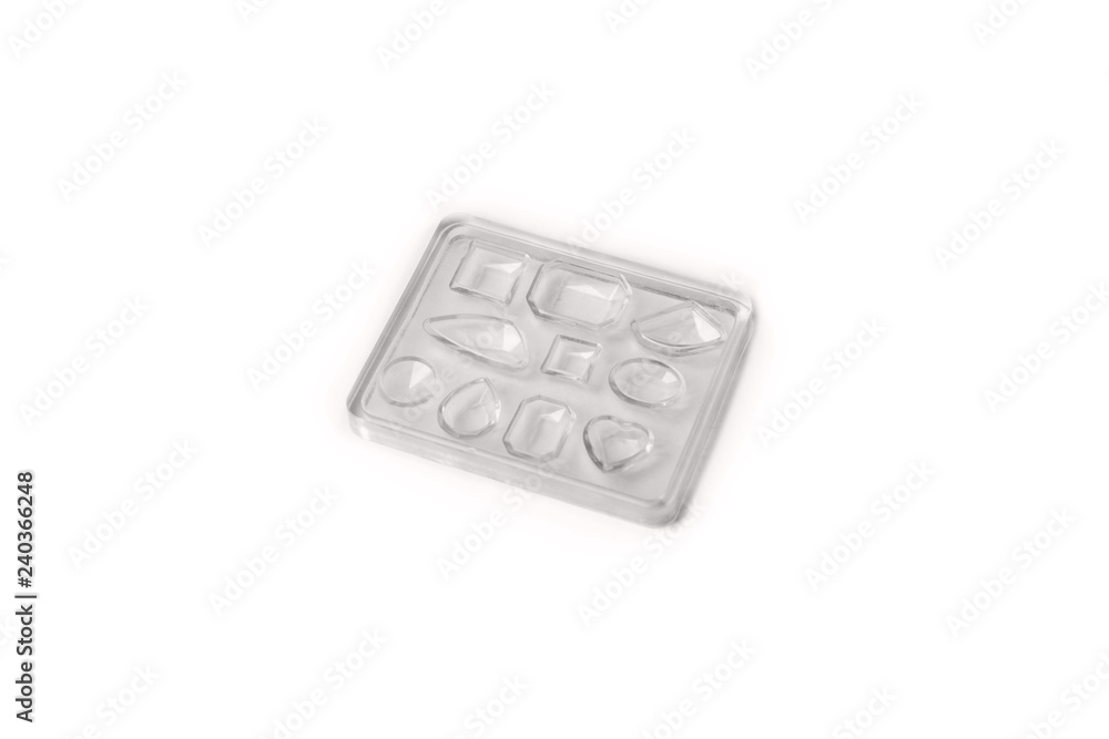 Molding Of Epoxy Resin shaped / Castings DIY Jewelry Making on white background Molding Of Epoxy Resin shaped / Castings DIY Jewelry Making on white background
