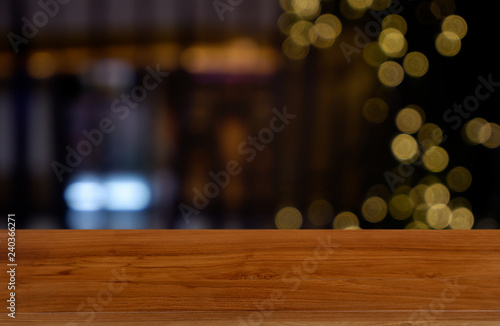 Empty dark wooden table in front of abstract blurred background of cafe and coffee shop interior. can be used for display or montage your products - Image.