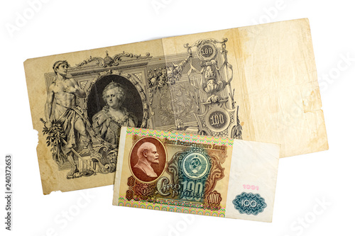  Paper banknotes of 100 rubles of Tsarist Russia and 100 rubles of the Soviet Union on a white background