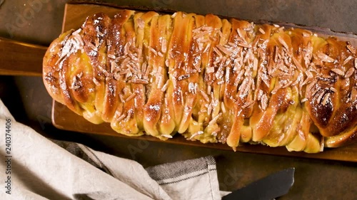 Christmas braided cinnamon cake on festive table. photo