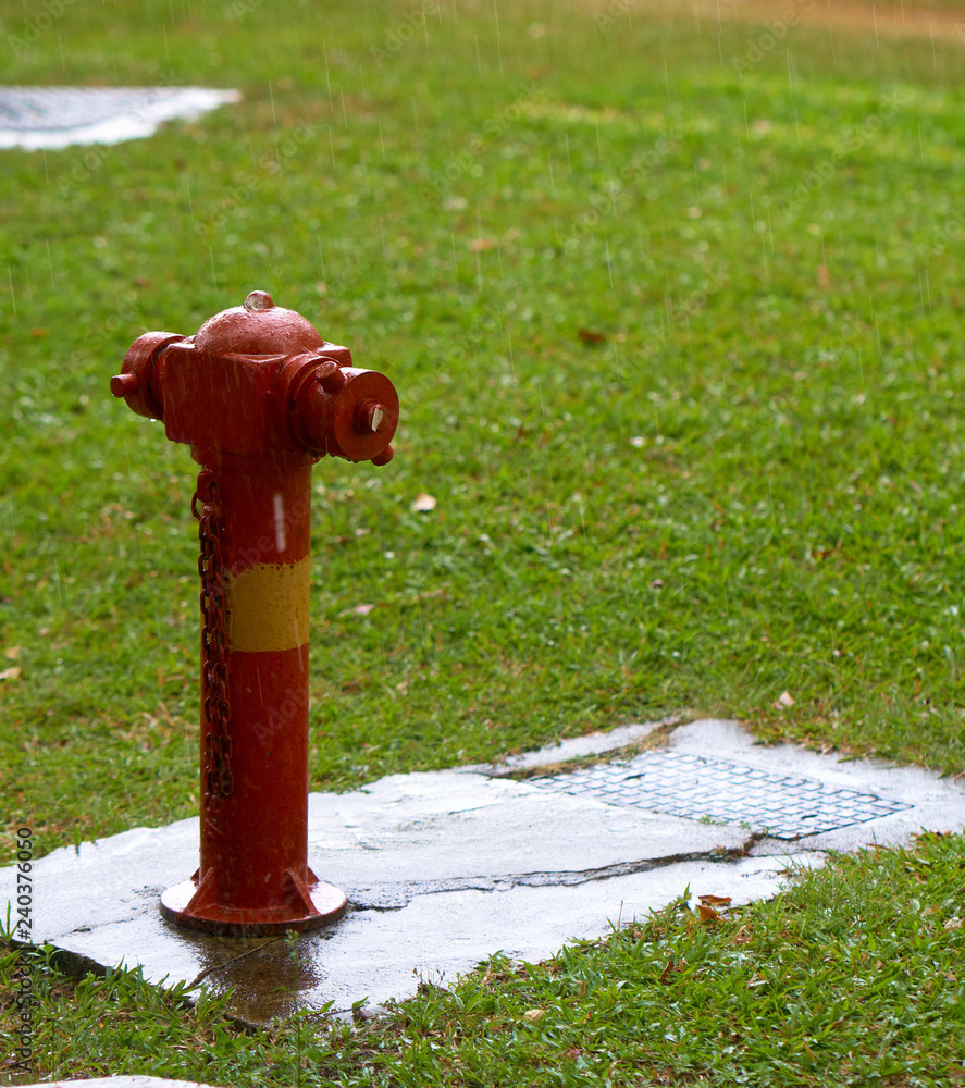 Fire hydrant in rainy weather. Singapore street. Fire hydrant in rainy weather. Singapore street.