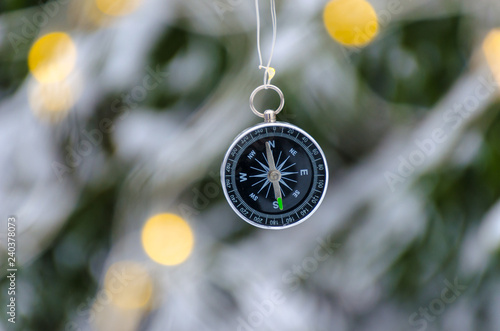 The compass in the hands during the winter travel