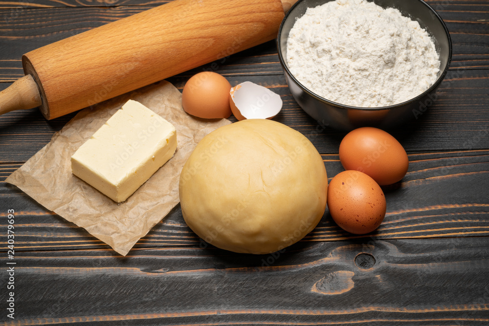 unrolled and unbaked Shortcrust pastry dough recipe on wooden background unrolled and unbaked Shortcrust pastry dough recipe on wooden background