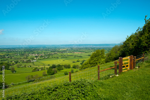 Extensive view towards the River Severn and The Forest of Dean over a patchwork of fields, Coaley Peak Picnic Site and Viewpoint, Gloucestershire, UK