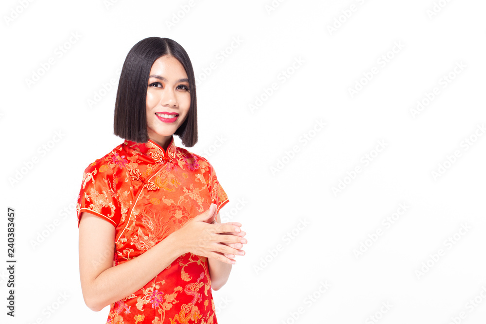 Chinese woman wear qipao for chinese new year day with attractive smile, isolated on white background Chinese woman wear qipao for chinese new year day with attractive smile, isolated on white background
