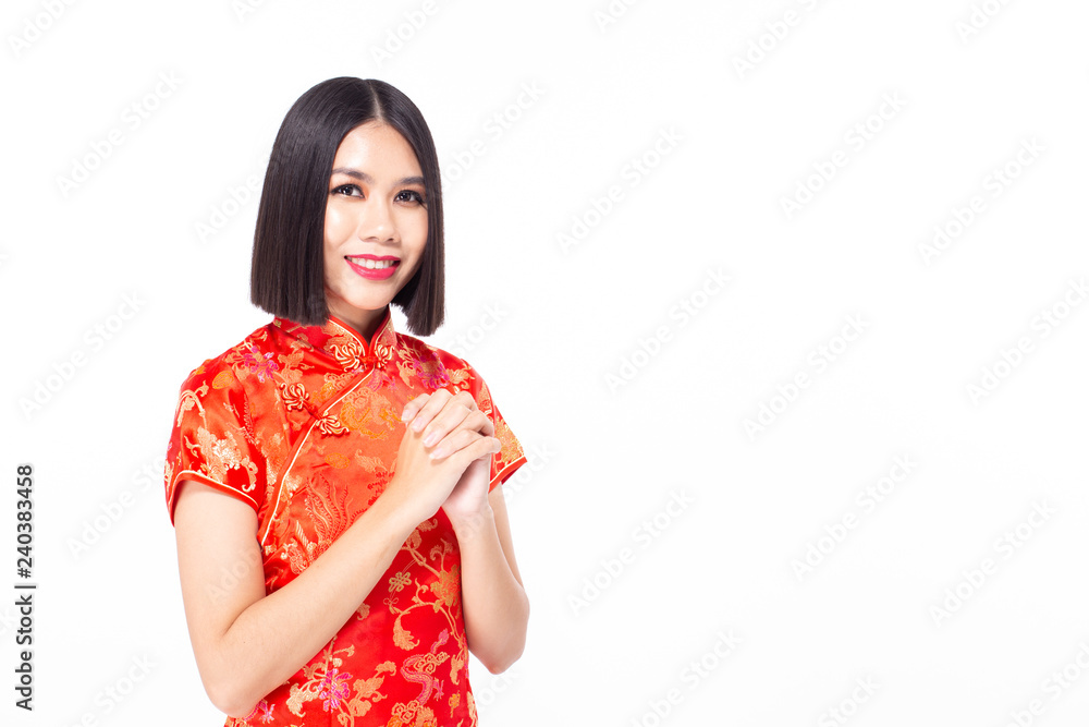 Chinese woman wear qipao for chinese new year day with attractive smile, isolated on white background Chinese woman wear qipao for chinese new year day with attractive smile, isolated on white background