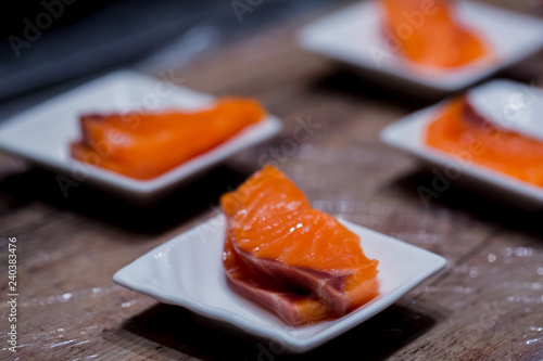 Selective focus to Salmon Sashimi fillet in a small dish
