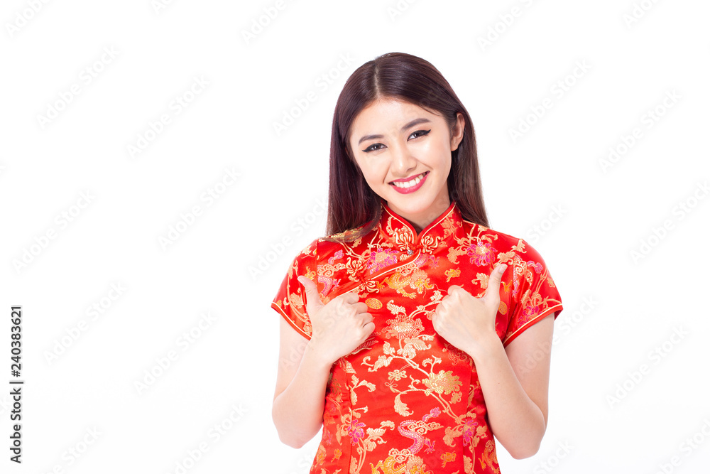 Chinese woman wear qipao for chinese new year day with attractive smile, isolated on white background Chinese woman wear qipao for chinese new year day with attractive smile, isolated on white background