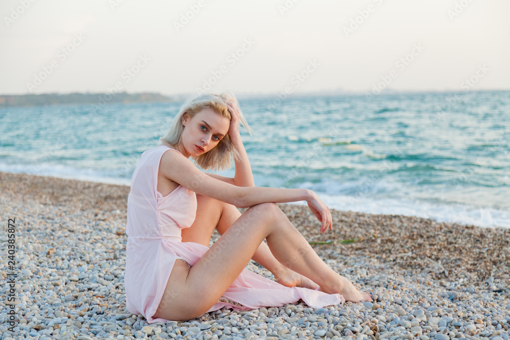 beautiful fashionable woman in underwear and a hat on the coast of the Ocean Beach beautiful fashionable woman in underwear and a hat on the coast of the Ocean Beach