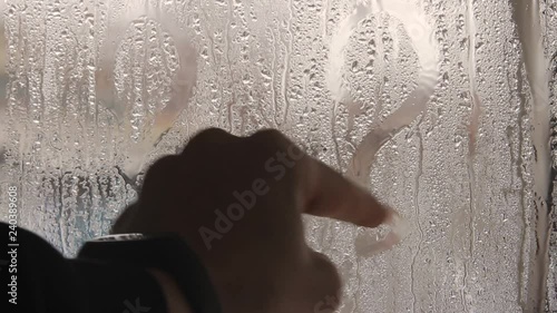 Wallpaper Mural A man's hand draws a question mark on a misted glass.Close up. Torontodigital.ca