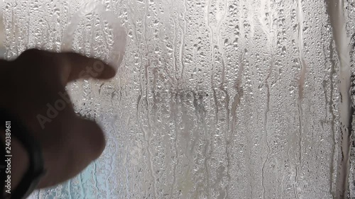 Wallpaper Mural A man's hand draws a question mark on a misted glass.Close up. Torontodigital.ca