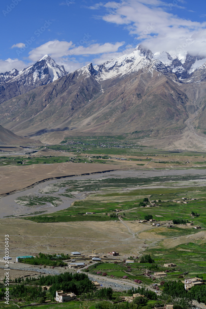 Zanskar valley landscape view from Karsha Gonpa with Himalaya mountains covered with snow and blue sky in Jammu & Kashmir, India,