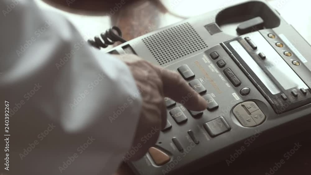 Doctor Dials On The Number Buttons On The A Wired Phone Doctor Dials On The Number Buttons On The A Wired Phone