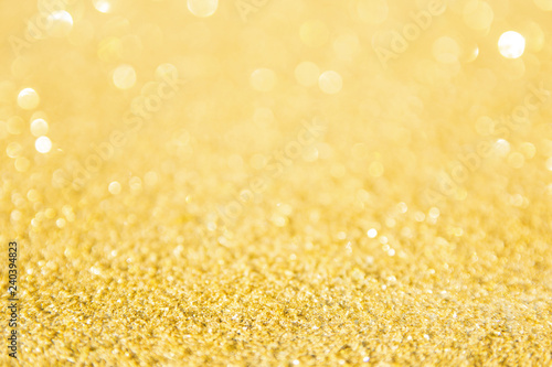 Defocused gold glitter background. Gold abstract bokeh background. Christmas abstract background © Achira22