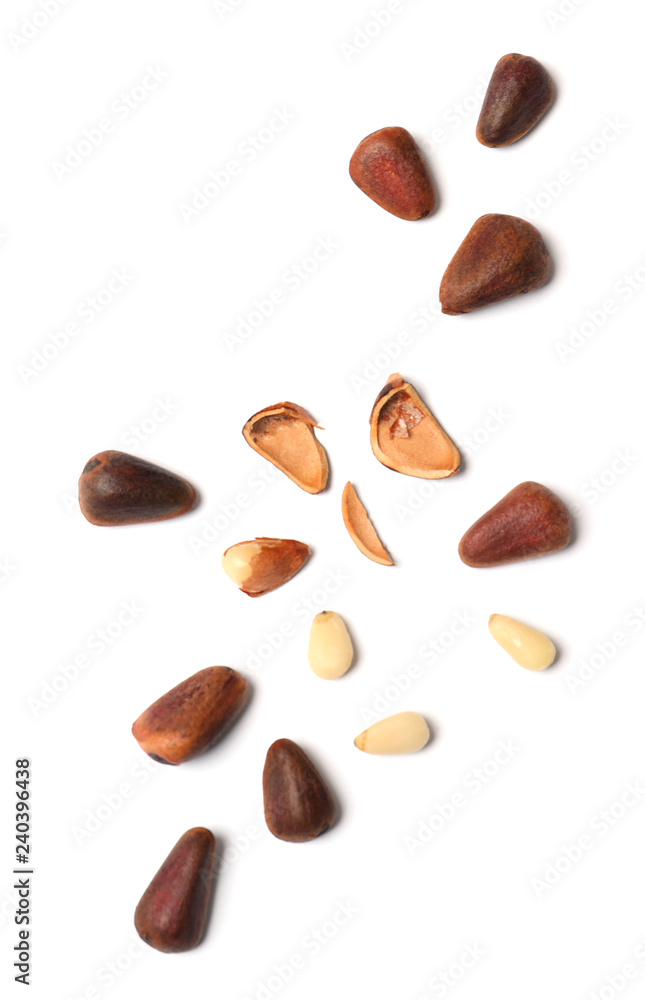 Obraz premium Composition with pine nuts on white background, top view
