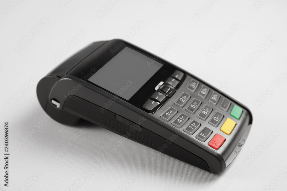 New modern payment terminal on grey background New modern payment terminal on grey background