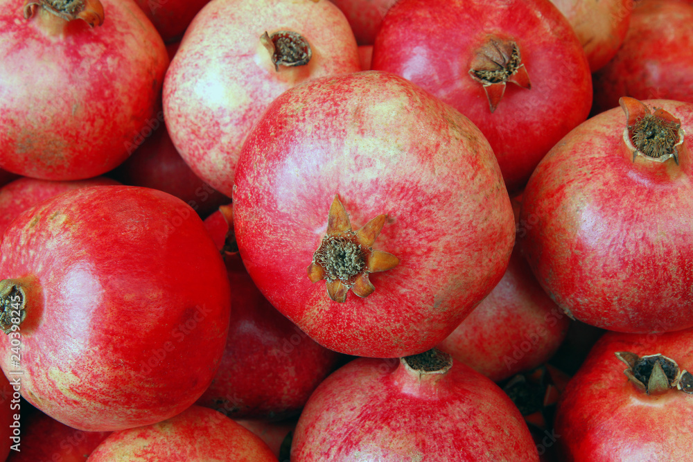 Group of pomegranates. Pomegranate closeup, background Group of pomegranates. Pomegranate closeup, background