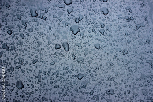 Rain droplets drops wet car blue black hood surface texture