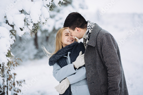Love story in the winter forest. Valentine's Day concept