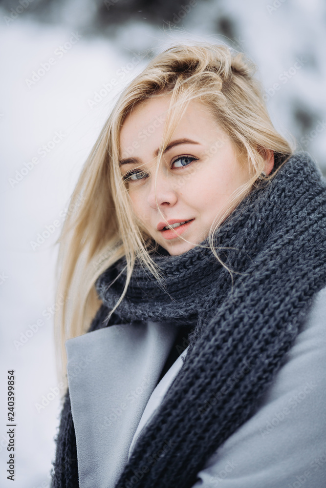portrait of a young blonde girl in winter forest portrait of a young blonde girl in winter forest