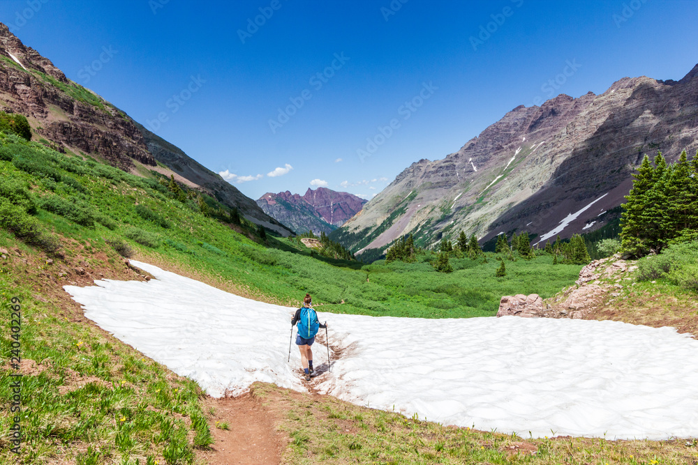 woman hiking in rocky mountains