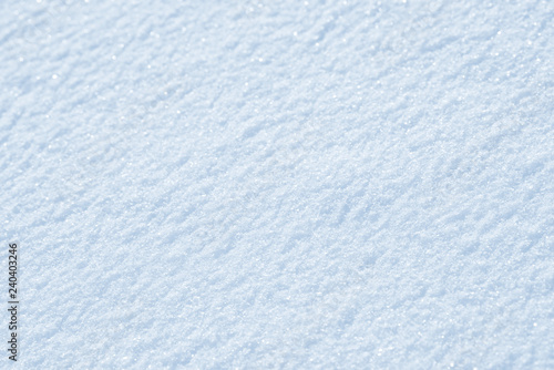 Fresh snow background texture. Winter background with snowflakes and snow mounds. Snow lumps.