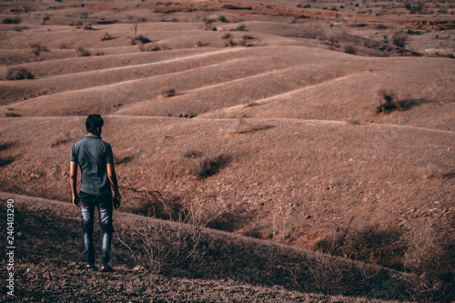 Man looking at arid landscape © Shiv Mer