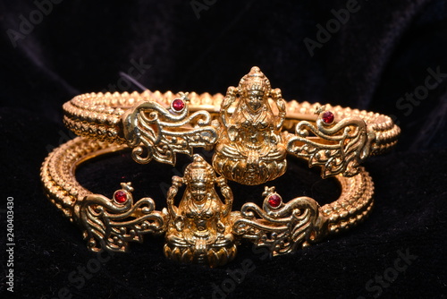 Fancy golden bracelets for woman fashion closeup macro image