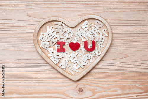 I Love U text on wooden table background. romantic and Valentine Day holiday Concept