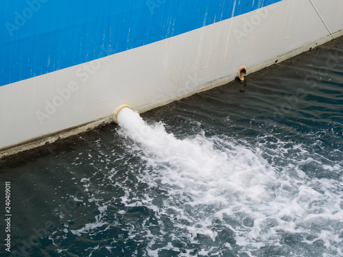 bilge water pumped out of the side of a ship