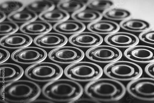 Machinery concept. Set of various gears and ball bearings old and new  BW  black and white  texture background