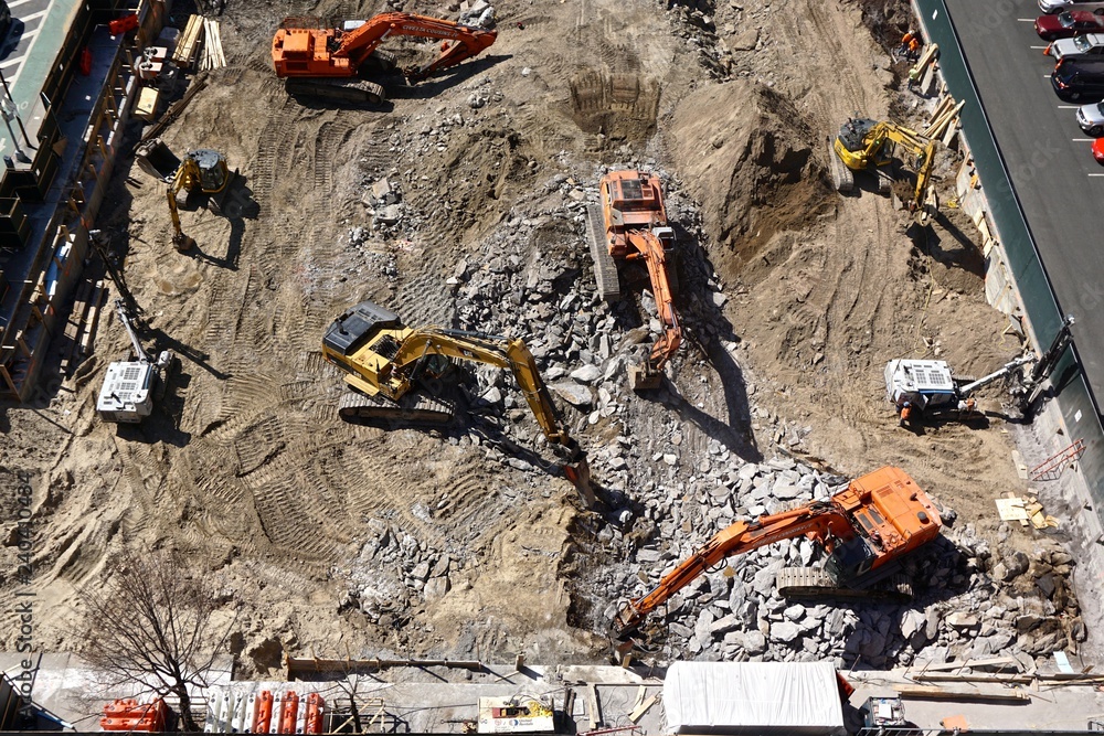 New York City, New York, USA: Heavy machinery breaks up Manhattan schist bedrock as construction begins on a high-rise building in midtown Manhattan.