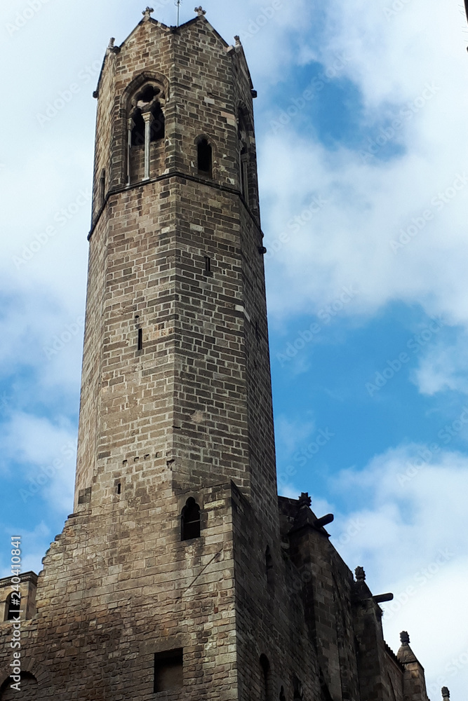 old stone tower against a cloudy sky old stone tower against a cloudy sky