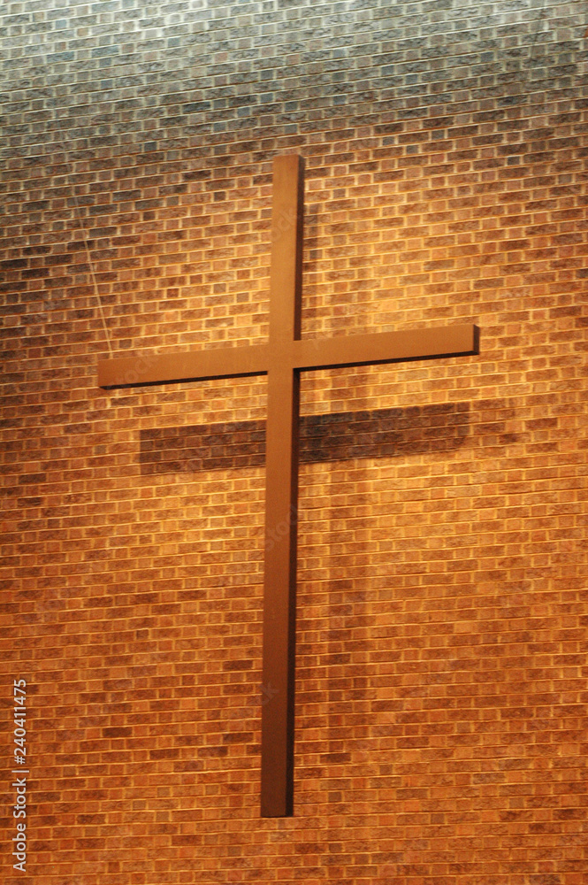 Roman Cross Suspended on a Brick Wall