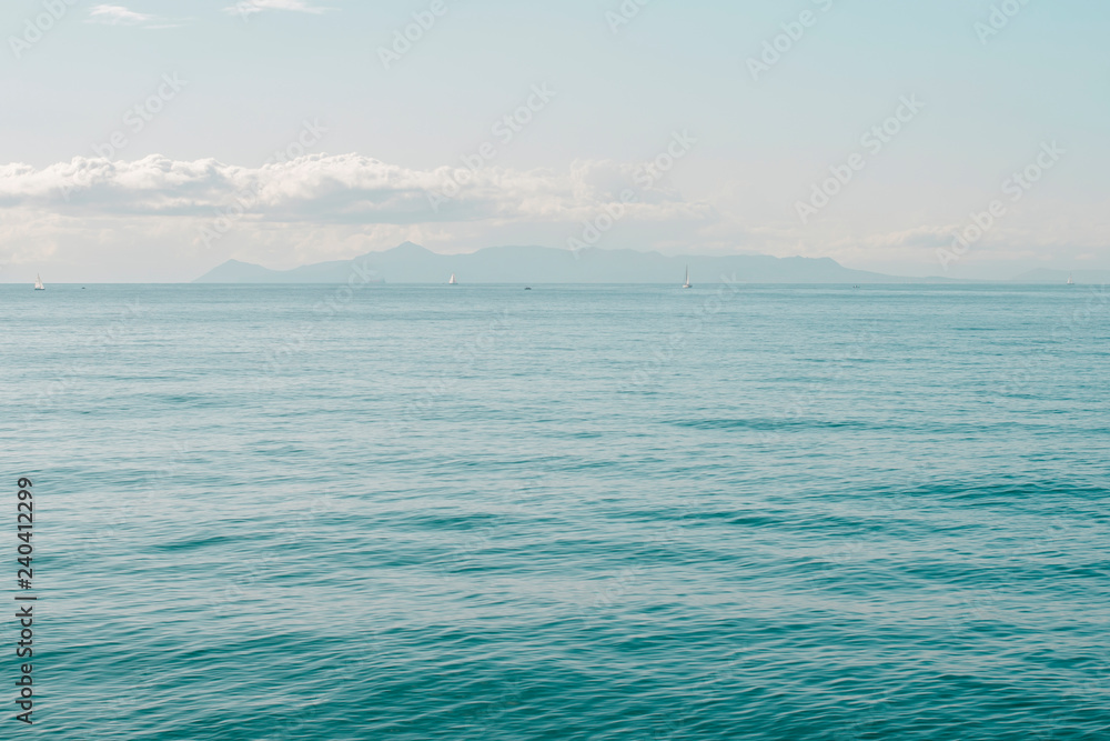 Seascape with sea horizon and almost clear deep blue sky. Athens, Greece Seascape with sea horizon and almost clear deep blue sky. Athens, Greece