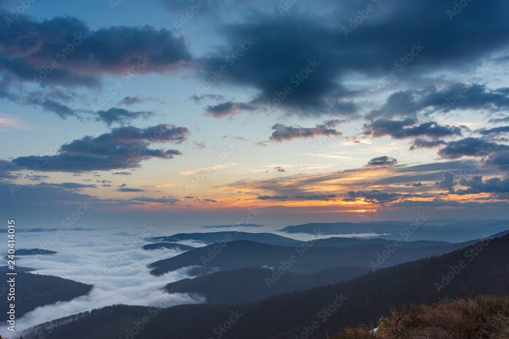 Beautiful sunrise in the Skole Beskydy with fantastic beauty over the sky, and the fog sea around the majestic Carpathian Mountains.