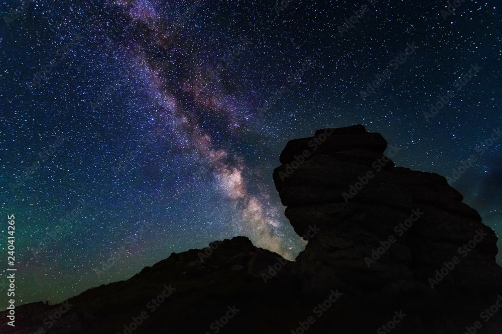 The fiery galaxy Milky way in the night sky with millions of stars over the White Elephant Observatory, which is in the Ukrainian Carpathian Mountains The fiery galaxy Milky way in the night sky with millions of stars over the White Elephant Observatory, which is in the Ukrainian Carpathian Mountains