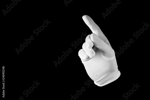 Hand in a white glove isolated on a black background. Gesture eye-catching. Gesticulation.