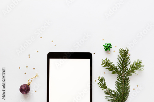 Christmas mockup with tablet and christmas decor, top view