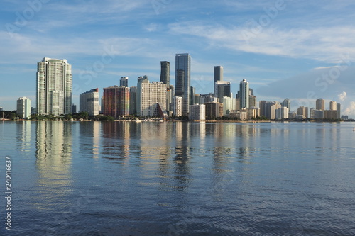 Miami  Florida 09-08-2018 City of Miami skyline and its reflection on the tranquil water of Biscayne Bay.