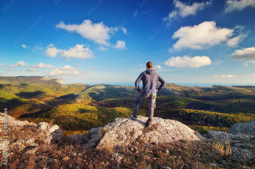 Fototapeta premium Man on top of mountain. Conceptual design.