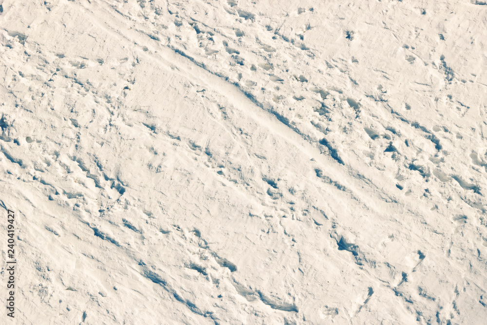 High angle view of snow texture in pink tone, background with copy space High angle view of snow texture in pink tone, background with copy space