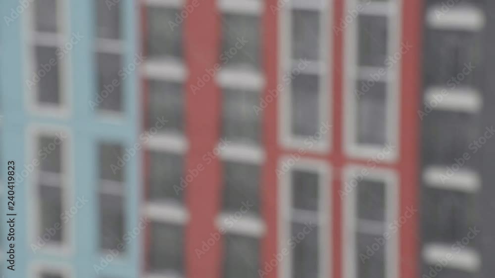 Snowing against building blurred Snowing against building blurred
