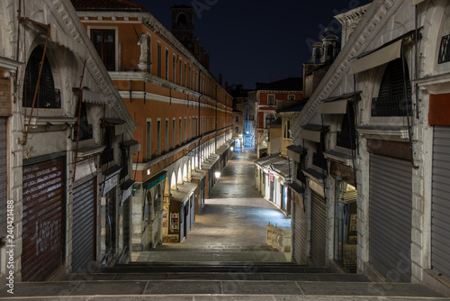 Night photo of the  Ruga dei Oresi  road from Rialto Bridge in Venice  Italy. In the district of San Polo is the road that goes from the bridge to the market area.