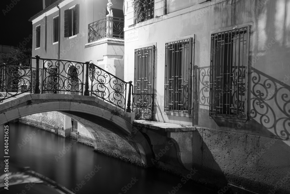 Night view Ponte Giustinian, on the Rio de San Vidal. Campiello